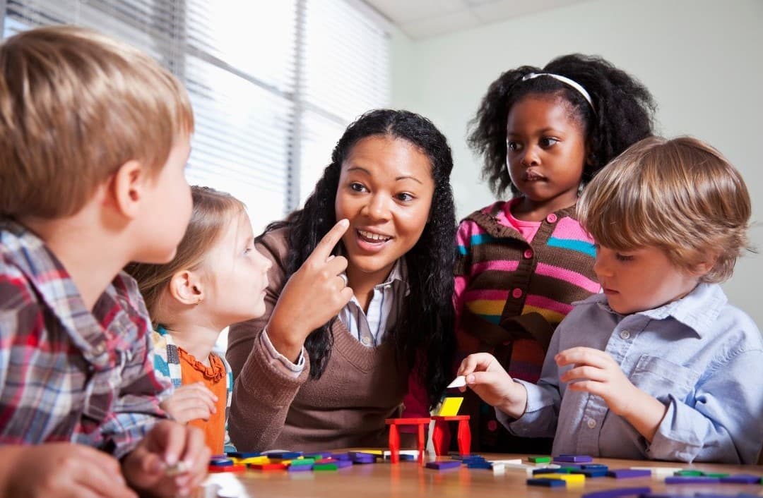 A therapist working with a small group of children